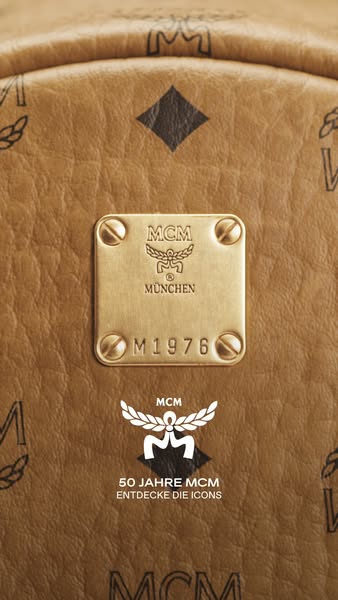 This ad showcases an MCM product, highlighting its branding details and celebrating the brand's 50th anniversary.