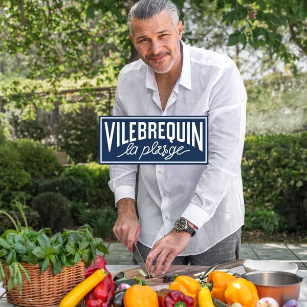 An image ad featuring a man preparing vegetables on an outdoor table. The ad showcases the Vilebrequin brand, emphasizin
