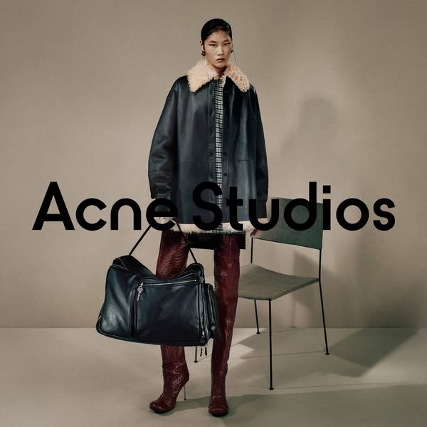 This ad features a model showcasing Acne Studios apparel and accessories. The ad focuses on the brand's aesthetic an