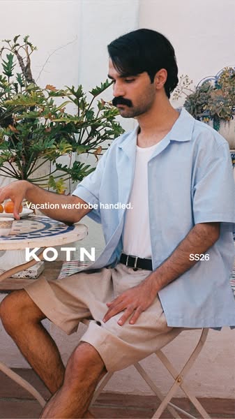 Image promoting KOTN brand clothing items: a blue short sleeve shirt and tan shorts.