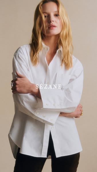 This ad features a woman wearing a white button-down shirt from Sézane. The ad focuses on the shirt's design and fit