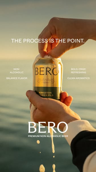 This ad focuses on the process and details of a can of BERO Premium Non-Alcoholic Beer. The can is being held with the t