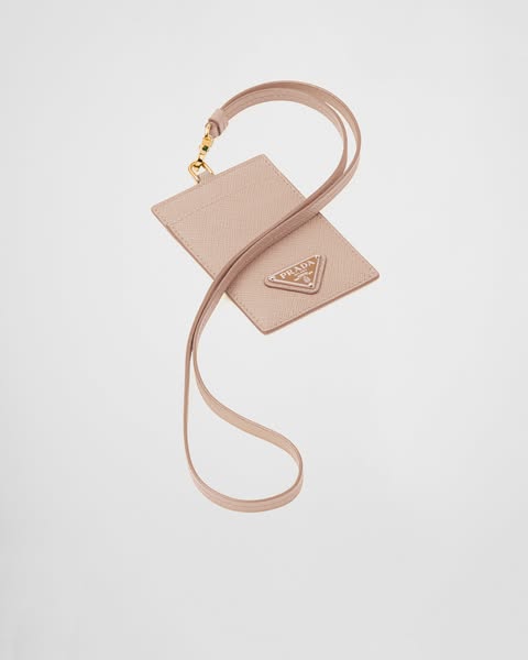 This ad showcases a Prada card holder with a lanyard. The ad focuses on the product's design and branding.