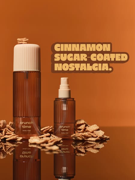 This ad features two bottles of Crunch Time body mist, surrounded by cereal pieces. The ad uses the tagline "Cinnam