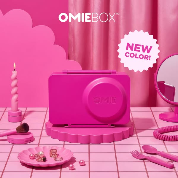 A pink monochromatic product shot featuring the OmieBox lunchbox in a new color.