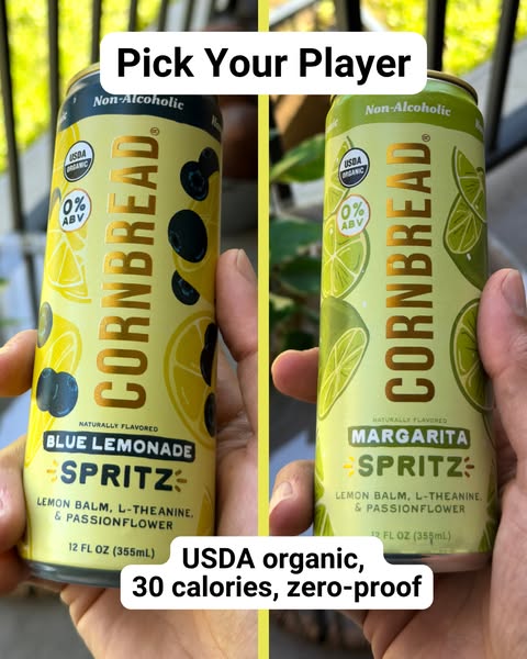 The ad is comparing two different flavors of Cornbread Spritz, a non-alcoholic drink that is USDA organic, and has 30 ca
