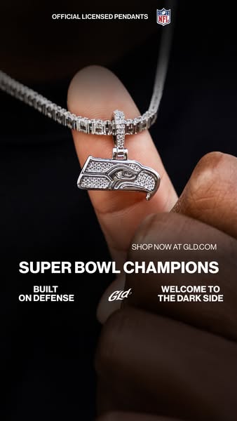 This image ad by GLD promotes its officially licensed NFL pendants. The ad showcases a close-up of the Seattle Seahawks 