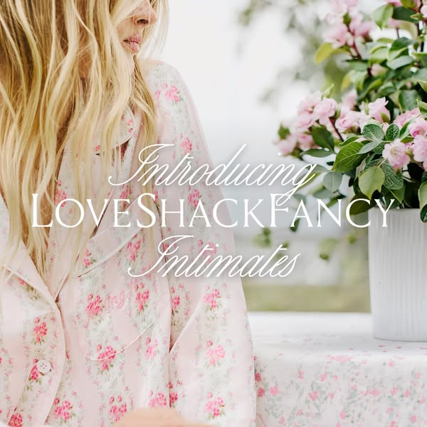 This ad is introducing LoveShackFancy's new line of intimates, by showing a woman wearing a matching pajama set in f