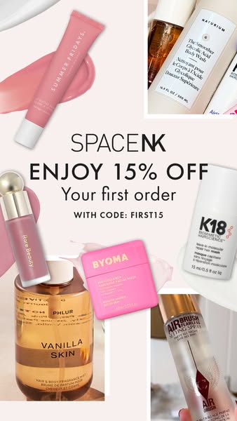 A Space NK ad features a flatlay with products from Summer Fridays, Naturium, Rare Beauty, Phlur, Byoma, K18, and Charlo