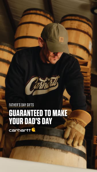 A Father's Day-themed image ad featuring a man wearing Carhartt apparel and working with wooden barrels, promoting C