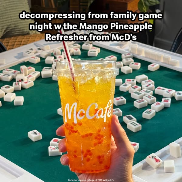 This ad promotes the Mango Pineapple Refresher from McDonald's as a way to decompress from family game night. The im