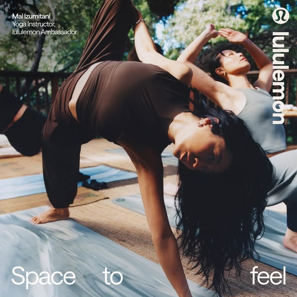 This image ad showcases lululemon apparel being worn in a yoga setting. Two instructors are mid-pose. The ad promotes sp
