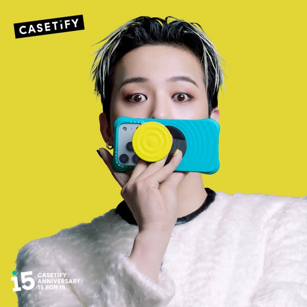 This ad features a person holding a turquoise Casetify phone case with a yellow grip attachment over their mouth, with t