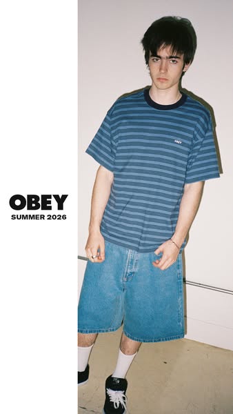This ad for OBEY clothing features a model wearing a striped t-shirt and jean shorts from the brand's summer 2026 co