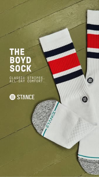 An image ad for Stance Boyd Socks. The socks are white with stripes at the top in red and blue. The text calls out the c