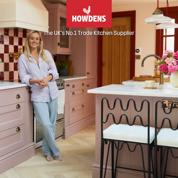 This image ad for Howdens promotes the brand as the UK's number one trade kitchen supplier. It features a woman stan