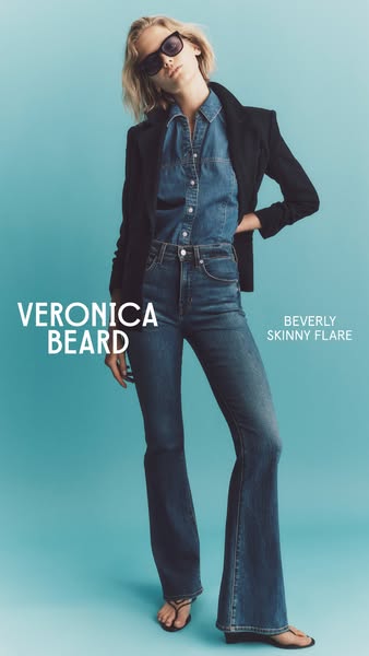 This ad features a woman posing in a pair of Veronica Beard Beverly Skinny Flare jeans. The ad is shot in a studio with 