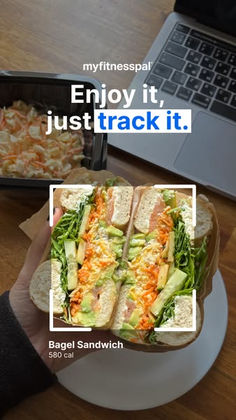 This ad for MyFitnessPal shows a person holding a bagel sandwich with a white square around it, as if the app is scannin