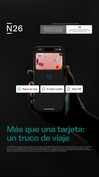 This ad for N26 promotes the travel benefits of the card. The ad shows a hand holding a phone with the N26 app open, dis