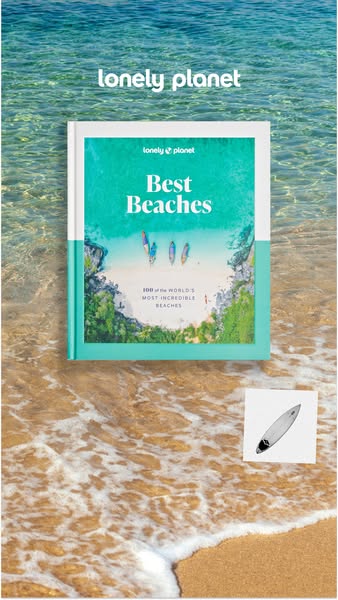This ad for Lonely Planet features a copy of their "Best Beaches" book laying on the sand at a beach. A small 