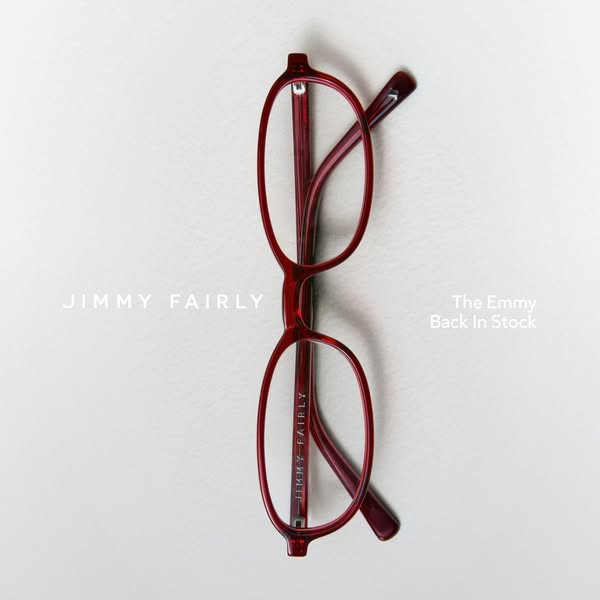 This ad features a pair of red Jimmy Fairly glasses on a white surface. The headline indicates that the 'Emmy' g