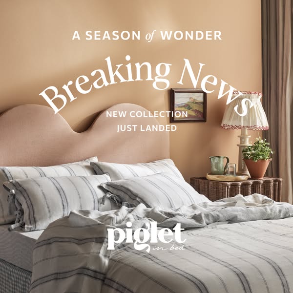 This image ad announces a new collection from Piglet in Bed, featuring a bedroom scene with the brand's striped bedd