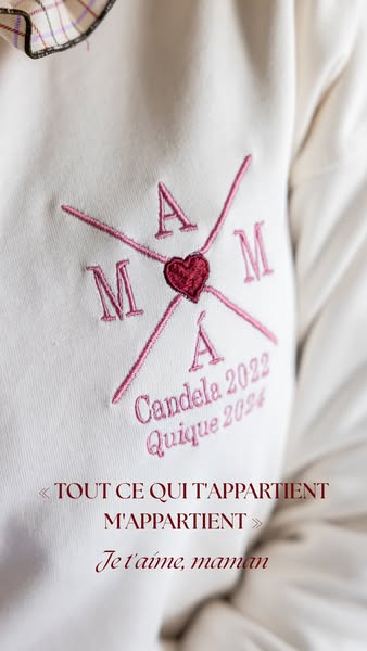 This ad features a close-up shot of a white sweatshirt with custom embroidery for a mother. It uses a simple, heartfelt 