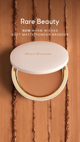 The ad showcases Rare Beauty's Soft Matte Powder Bronzer, highlighting its texture and brand identity. It aims to ap