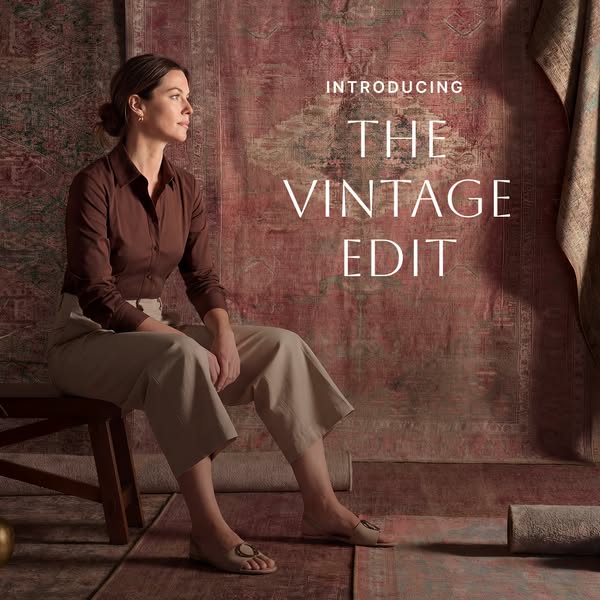 This ad showcases the brand's vintage rug edit with a lifestyle shot of a model sitting in front of a backdrop of vi