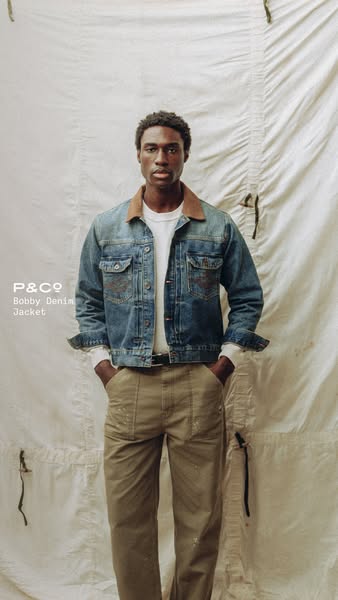 This image is an ad for the Bobby Denim Jacket from P&Co. The ad features a person wearing the jacket in front of a 