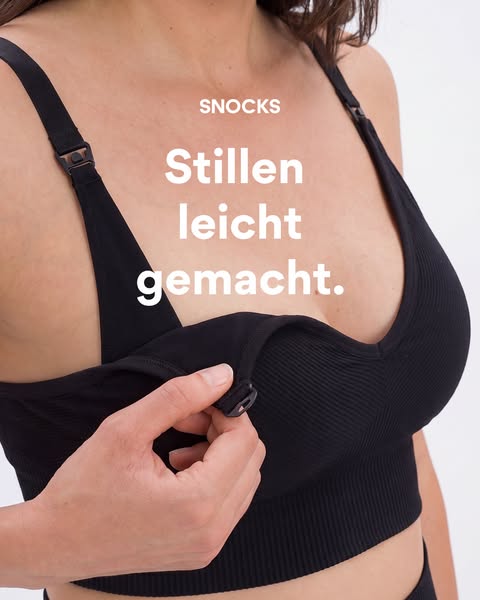 This ad for Snocks features a person's hands opening the front of a black nursing bra. The ad aims to highlight how 