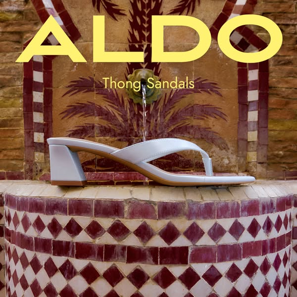An ad for ALDO Thong Sandals. It shows a pair of light blue ALDO sandals on a stone surface, with the brand's name a