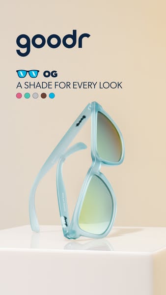 This image ad features light blue sunglasses on a white surface with a tan background. The ad is promoting different sty