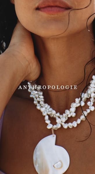 This Anthropologie ad features a close-up shot of a woman wearing a triple-strand pearl necklace with a mother-of-pearl 