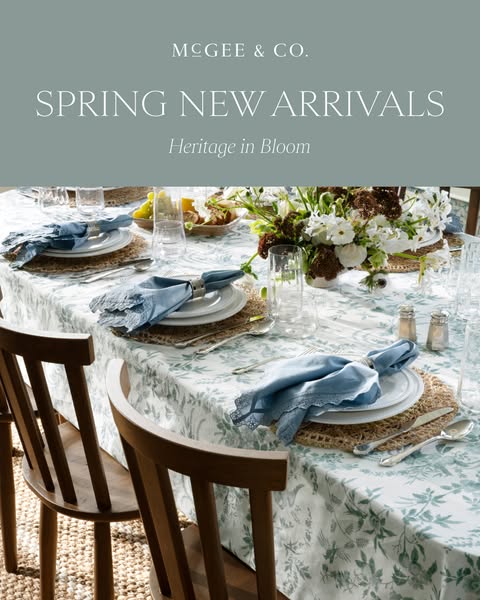 The ad showcases a beautifully set dining table featuring items from McGee & Co.'s spring collection, emphasizin