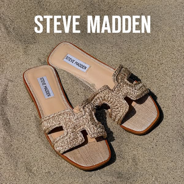 This ad features a pair of Steve Madden sandals displayed on sand, highlighting the brand and the product's woven de