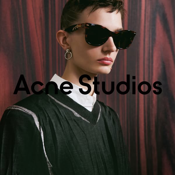 This image features a model wearing sunglasses by Acne Studios. The ad focuses on the sunglasses. The brand name is prom