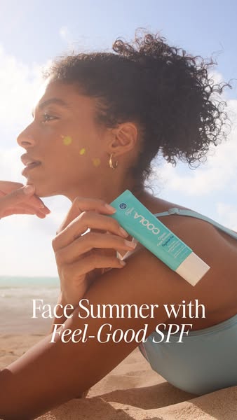This ad promotes COOLA's SPF products. It features a woman at the beach and is designed to show how people can face 