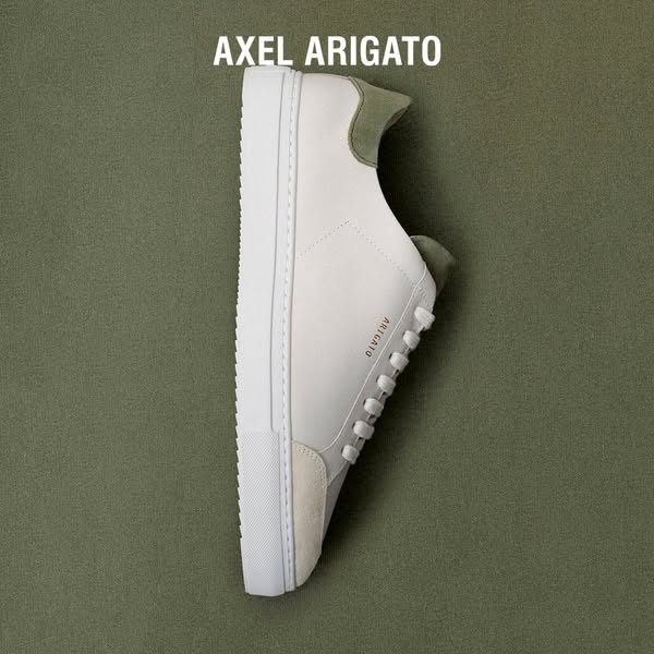 This ad features a single Axel Arigato shoe against a matching background, emphasizing the shoe's design and brand.
