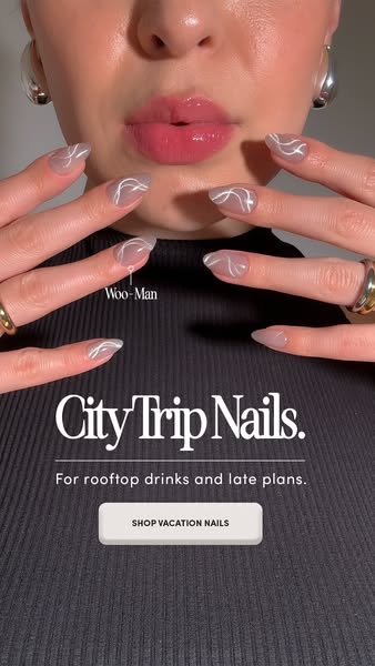 This ad for Woo-Man features a set of City Trip Nails, emphasizing their suitability for rooftop drinks and late plans.