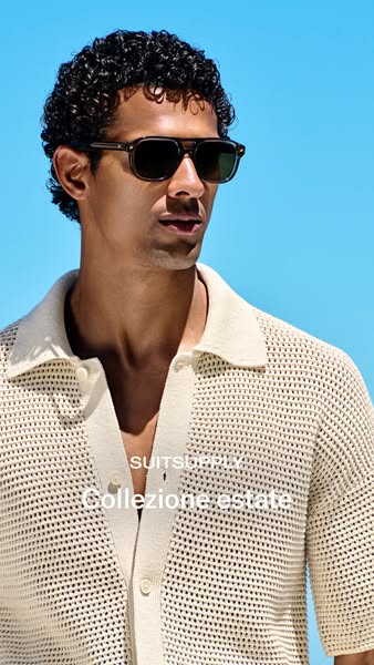 This ad features a person wearing sunglasses. The ad's focus is to highlight the brand Suitsupply and their new line