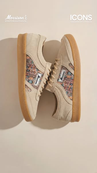 This image ad showcases a pair of cream-colored Morrison brand shoes with brown rubber soles.