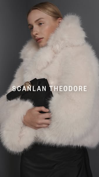 This ad features a woman wearing a SCANLAN THEODORE coat and carrying a black purse. The focus of the ad is to showcase 