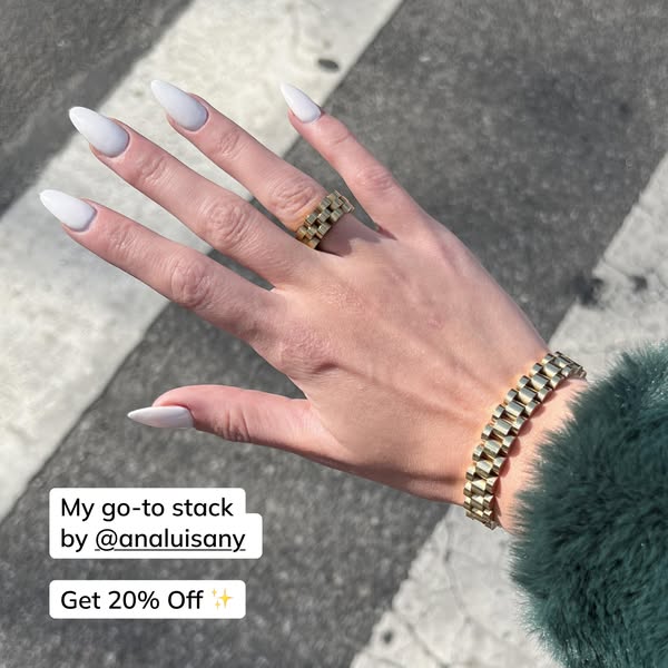 This ad showcases a stack of Ana Luisa jewelry including a gold ring and bracelet and offers 20% off.