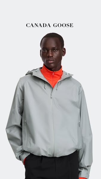 This ad features a man modeling a hooded jacket from Canada Goose. The shot is medium and focuses on the jacket.