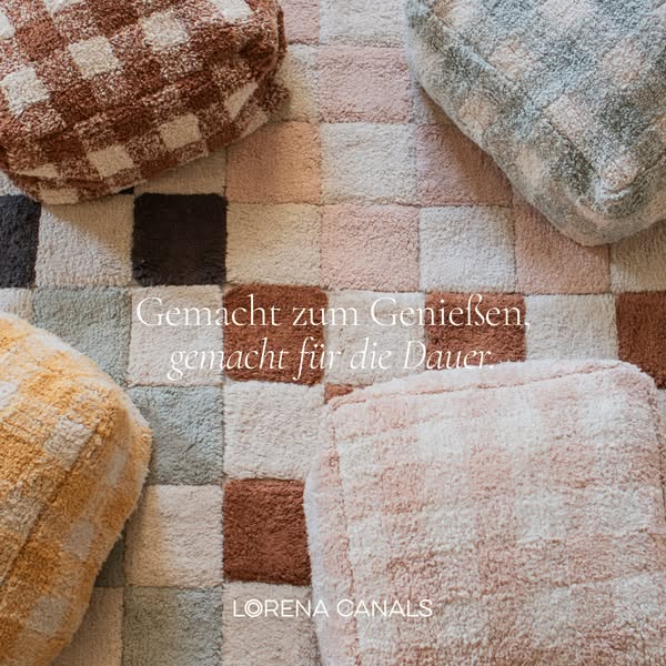 This ad features a bird's eye view of the Lorena Canals square rugs and poufs. The advertisement emphasizes the prod