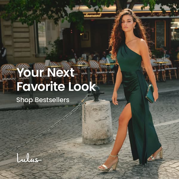 An image ad featuring a woman in a green evening gown walking down a cobblestone street. It includes an outdoor dining a