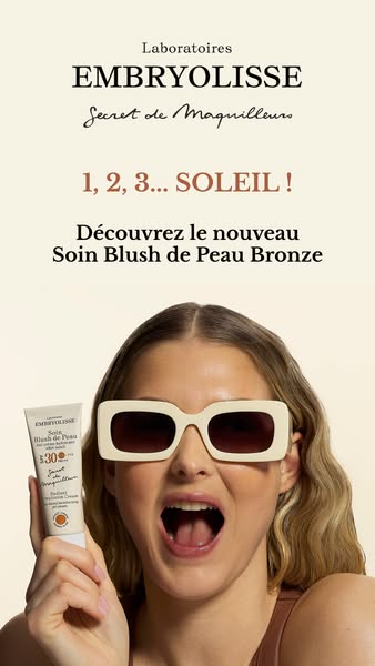 This ad features a woman holding Embryolisse's Soin Blush de Peau Bronze.