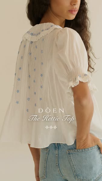 This ad features a woman wearing the Doen "The Hettie Top", promoting the brand's aesthetic and the top