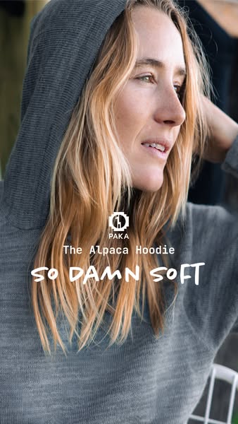 The ad features a woman wearing a grey Alpaca Hoodie. The ad puts emphasis on how soft the hoodie is by displaying the t